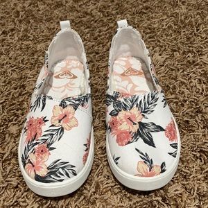 Size 13 slip on girls flower shoes. Never worn outside. Basically new.